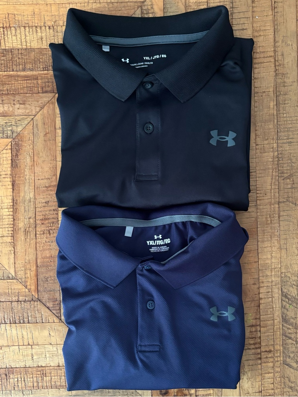 Youth XL Under Armour Black and Navy Polo Shirts - 2 Pack